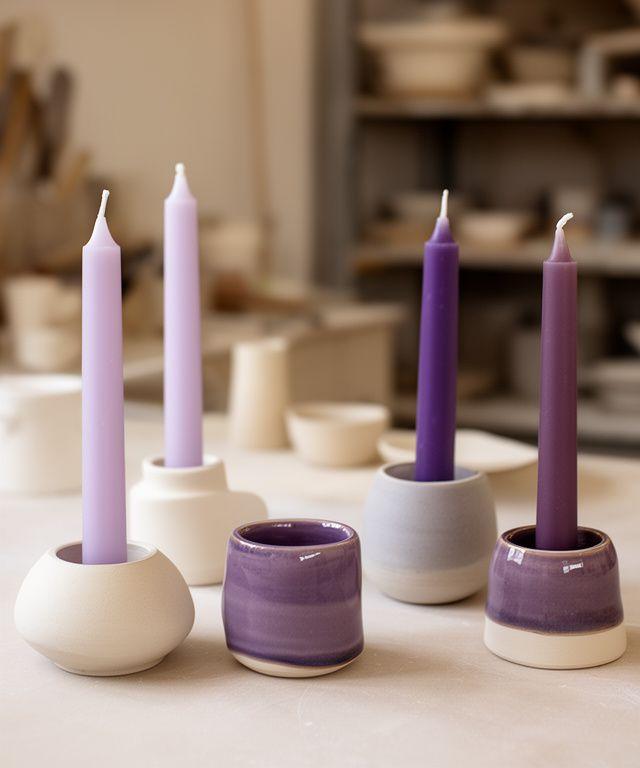 Ceramic candle holders and decorative candles arranged on a studio table in Zurich with soft daylight